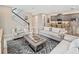 Beautiful living room with modern staircase open to the kitchen area at 2332 Salty Winds Way, Kissimmee, FL 34747