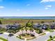 Aerial view of a lakefront community featuring well-manicured lawns and palm trees at 2614 Mead Ave, St Cloud, FL 34771