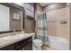 Bathroom with a shower-tub, decorative shower curtain, and a neutral color scheme at 2614 Mead Ave, St Cloud, FL 34771