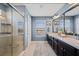 Bathroom features double sinks, a glass shower, and a neutral color palette at 2614 Mead Ave, St Cloud, FL 34771
