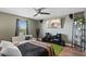 Stylish bedroom featuring contemporary decor, hardwood floors, and ample natural light at 2614 Mead Ave, St Cloud, FL 34771