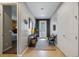 Stylish foyer with tile flooring, decorative mirror, and a view into the adjacent living spaces at 2614 Mead Ave, St Cloud, FL 34771