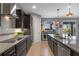 Open concept kitchen with stainless steel appliances, granite countertops, and a central island at 2614 Mead Ave, St Cloud, FL 34771