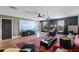 Spacious living room with a projector screen, comfortable seating, and modern decor at 2614 Mead Ave, St Cloud, FL 34771