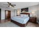 Inviting main bedroom featuring warm wood floors, a decorative art piece, and a ceiling fan at 2614 Mead Ave, St Cloud, FL 34771