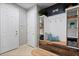 Functional mudroom with built-in bench, storage shelves, and easy access to the garage at 2614 Mead Ave, St Cloud, FL 34771