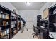Home office with built-in bookshelves, desk, and a telescope for stargazing at 2614 Mead Ave, St Cloud, FL 34771