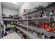 Walk-in pantry with ample shelving for organized storage at 2614 Mead Ave, St Cloud, FL 34771