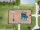 Aerial view of a well-equipped community playground with shade and modern play structures at 2614 Mead Ave, St Cloud, FL 34771
