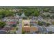 Aerial view of home, showcasing its location surrounded by lush trees and manicured lawns at 2803 Charing Cross Way, Orlando, FL 32837