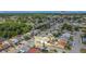 Aerial view of home, showcasing its location surrounded by lush trees and manicured lawns at 2803 Charing Cross Way, Orlando, FL 32837