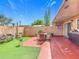 Back yard with a patio, artificial turf, BBQ and outdoor furniture at 2803 Charing Cross Way, Orlando, FL 32837