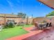 Back yard with a patio, artificial turf, BBQ and outdoor furniture at 2803 Charing Cross Way, Orlando, FL 32837