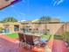 Back yard with a patio, artificial turf, BBQ and outdoor furniture at 2803 Charing Cross Way, Orlando, FL 32837
