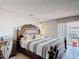Bedroom with stylish furnishings, a sliding glass door, and tile flooring at 2803 Charing Cross Way, Orlando, FL 32837