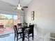 The dining area has tile floors, neutral walls, and a view of the patio at 2803 Charing Cross Way, Orlando, FL 32837