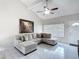 The living room features tile floors, neutral walls and vaulted ceilings at 2803 Charing Cross Way, Orlando, FL 32837