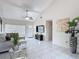 Bright living room featuring tile floors, neutral walls and vaulted ceilings at 2803 Charing Cross Way, Orlando, FL 32837