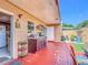 Outdoor kitchen features a sink and food prep area on a red brick patio at 2803 Charing Cross Way, Orlando, FL 32837