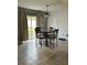 Breakfast nook with a sliding door to the patio and a decorative light fixture at 2806 Polson Dr, Kissimmee, FL 34758
