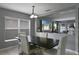 Dining room offers a modern table and chairs, a large window, and an open concept design at 2806 Polson Dr, Kissimmee, FL 34758