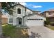 Charming two-story home with attached two car garage and well-manicured lawn at 2806 Polson Dr, Kissimmee, FL 34758