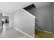 Hallway featuring tile floors and a staircase leading to the second floor at 2806 Polson Dr, Kissimmee, FL 34758