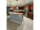 Spacious kitchen with stainless steel appliances, wood cabinets, and a center island at 2806 Polson Dr, Kissimmee, FL 34758