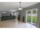 Open living room features access to the backyard, tile floors, and ample natural light at 2806 Polson Dr, Kissimmee, FL 34758