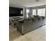 Cozy living room with a large sectional couch and big screen TV at 2806 Polson Dr, Kissimmee, FL 34758