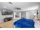 Spacious primary bedroom featuring a ceiling fan, TV and access to an ensuite at 2806 Polson Dr, Kissimmee, FL 34758