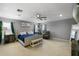 Main bedroom featuring a ceiling fan, a seating area, and natural light at 2806 Polson Dr, Kissimmee, FL 34758