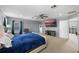 Spacious primary bedroom featuring a ceiling fan, and a large TV at 2806 Polson Dr, Kissimmee, FL 34758