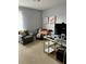 Home office with comfortable seating, modern desk setup, and neutral colors at 2806 Polson Dr, Kissimmee, FL 34758