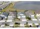 Aerial view of homes with a lake view and well-maintained lawns, showcasing community living at 2926 Wordsmith Rd, Kissimmee, FL 34746
