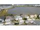 Aerial view of lakeside homes, displaying a community with water access and scenic surroundings at 2926 Wordsmith Rd, Kissimmee, FL 34746