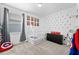 Playful bedroom features window, comic book posters, superhero decorations and a house bed at 2926 Wordsmith Rd, Kissimmee, FL 34746