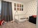bedroom featuring playful superhero decor, a modern house frame bed and a comfortable carpet at 2926 Wordsmith Rd, Kissimmee, FL 34746