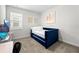 Comfortable bedroom featuring a blue daybed, neutral wall colors and natural light at 2926 Wordsmith Rd, Kissimmee, FL 34746