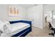 Comfortable bedroom featuring a blue daybed, neutral wall colors and natural light at 2926 Wordsmith Rd, Kissimmee, FL 34746