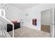 Bright room with a house bed, superhero decor, dresser and doorway at 2926 Wordsmith Rd, Kissimmee, FL 34746