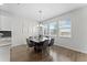 Elegant dining area featuring modern table set and a bright window view at 2926 Wordsmith Rd, Kissimmee, FL 34746