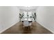 Dining room showcasing a modern table, chairs, chandelier, and large windows at 2926 Wordsmith Rd, Kissimmee, FL 34746