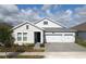 Charming single-Gathering home with a 3-car garage and beautifully paved driveway at 2926 Wordsmith Rd, Kissimmee, FL 34746