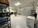 Spacious garage with ample storage space, a freezer, and an automatic door opener at 2926 Wordsmith Rd, Kissimmee, FL 34746