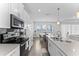 Elegant kitchen showcasing sleek countertops, tile backsplash, and stainless steel appliances at 2926 Wordsmith Rd, Kissimmee, FL 34746