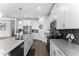 Bright kitchen with an island, stainless steel appliances, and a stylish tile backsplash at 2926 Wordsmith Rd, Kissimmee, FL 34746