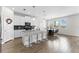 Beautiful kitchen with a center island and stylish barstool seating adjacent to dining area at 2926 Wordsmith Rd, Kissimmee, FL 34746