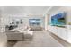 Bright, open-concept living room featuring a large sectional sofa and scenic lake views at 2926 Wordsmith Rd, Kissimmee, FL 34746
