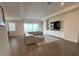 Open living area featuring recessed lights, a large sectional sofa, and scenic backyard views at 2926 Wordsmith Rd, Kissimmee, FL 34746